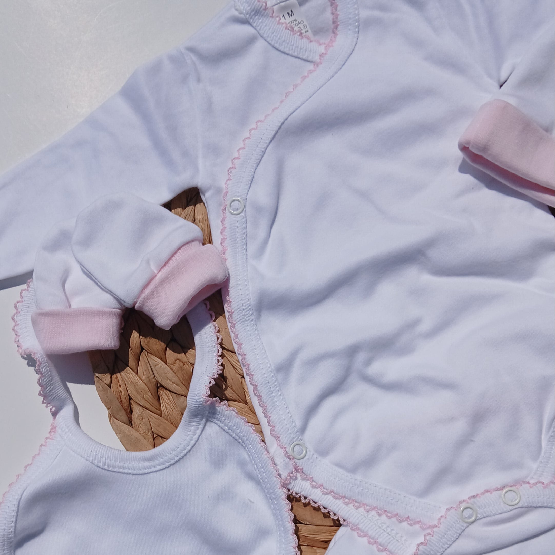 picot trim made with cotton bib, mittens hat included Baby outfit with white romper, pink headband, and white booties