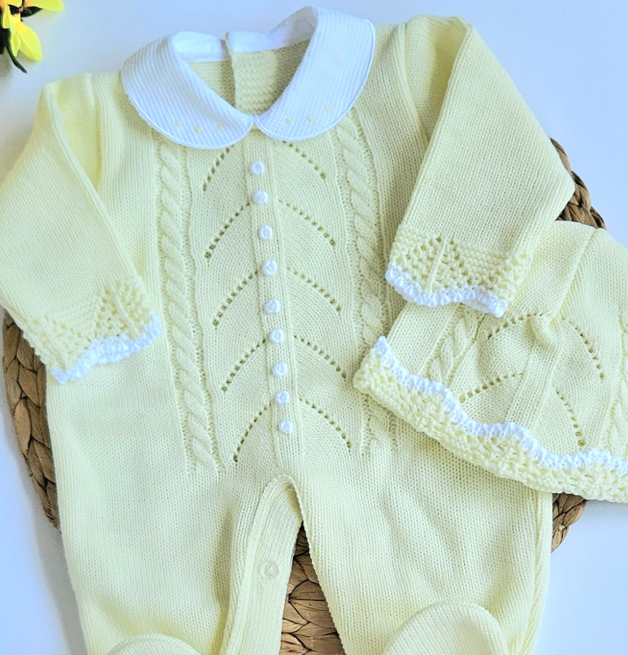 A yellow knitted baby romper with handmade embroidery, accompanied by a matching hat, displayed on a basket. Newborn Going home set , newborn neutral coming home set, baby boy yellow outfit