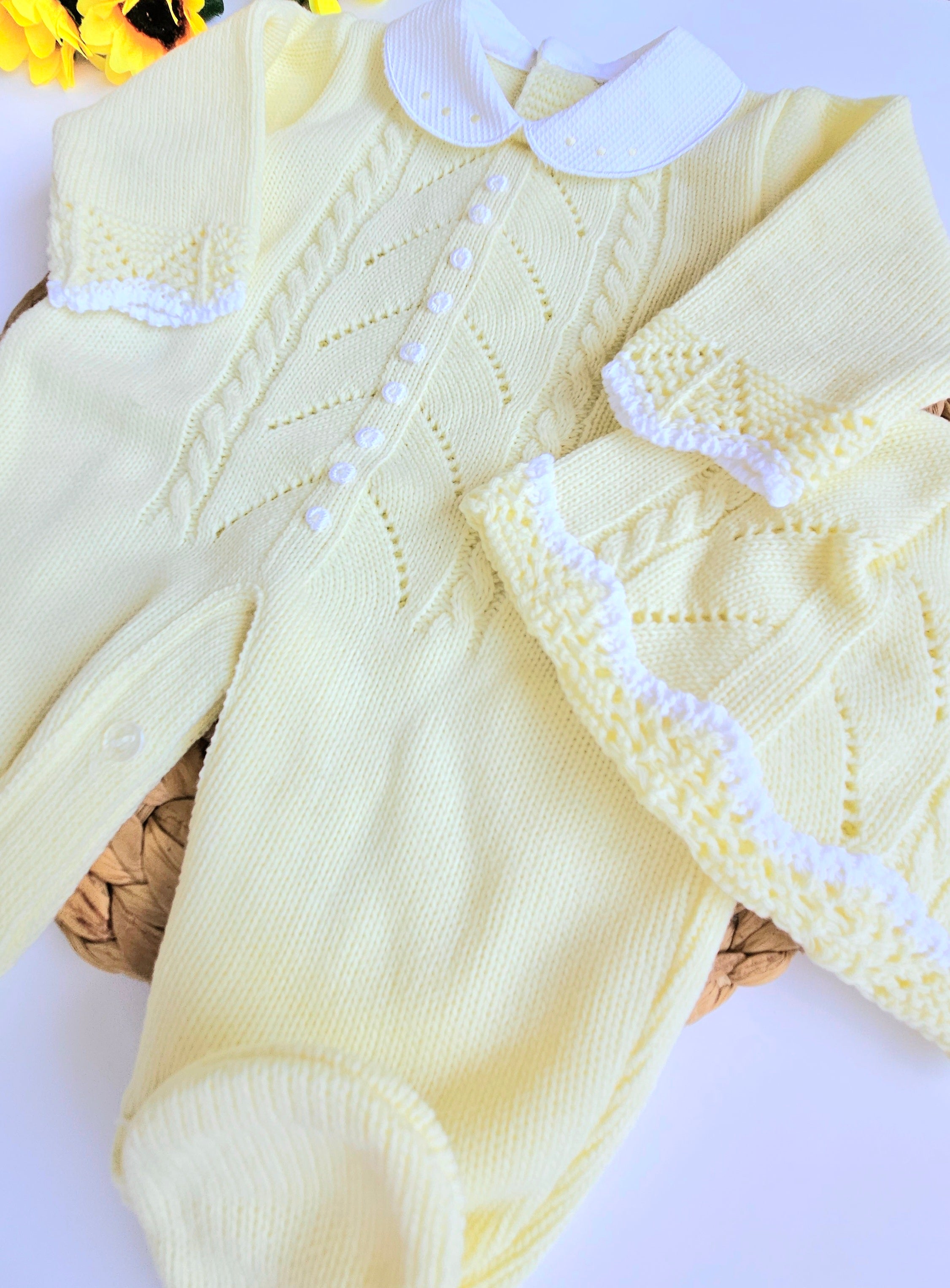 A yellow knitted baby romper with handmade embroidery, accompanied by a matching hat, displayed on a basket. Newborn Going home set , newborn neutral coming home set, baby boy yellow outfit