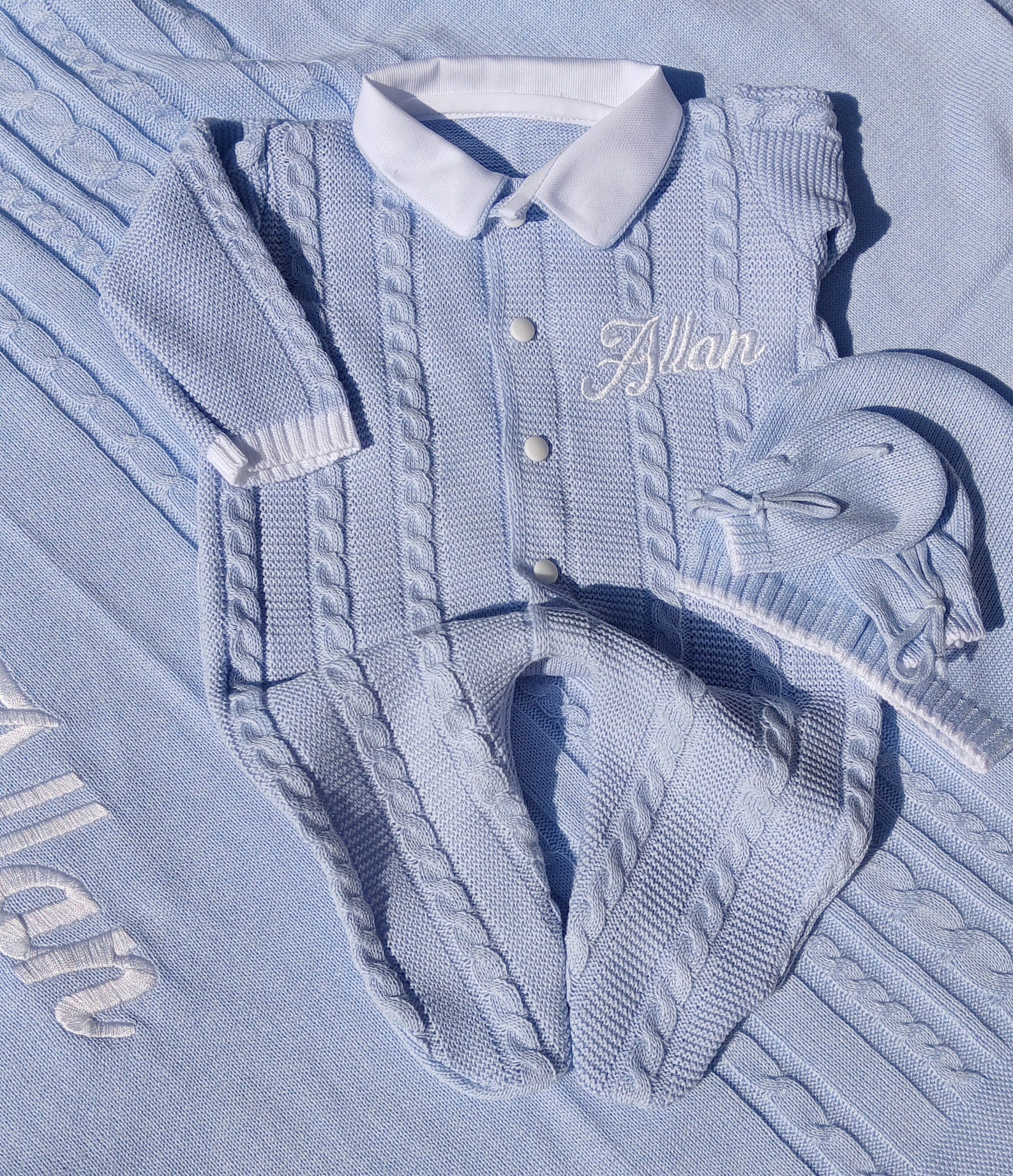 light blue knitted newborn romper