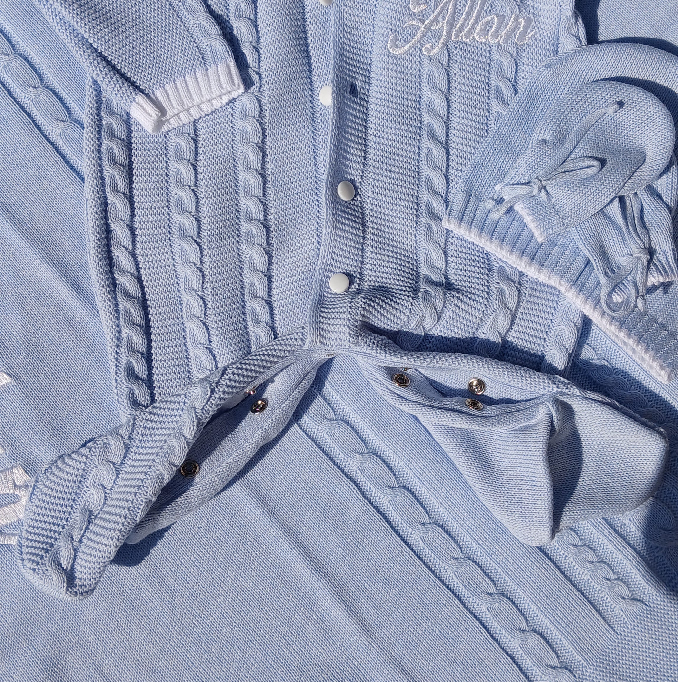 Light blue denim jacket with a brand logo on a matching fabric background
