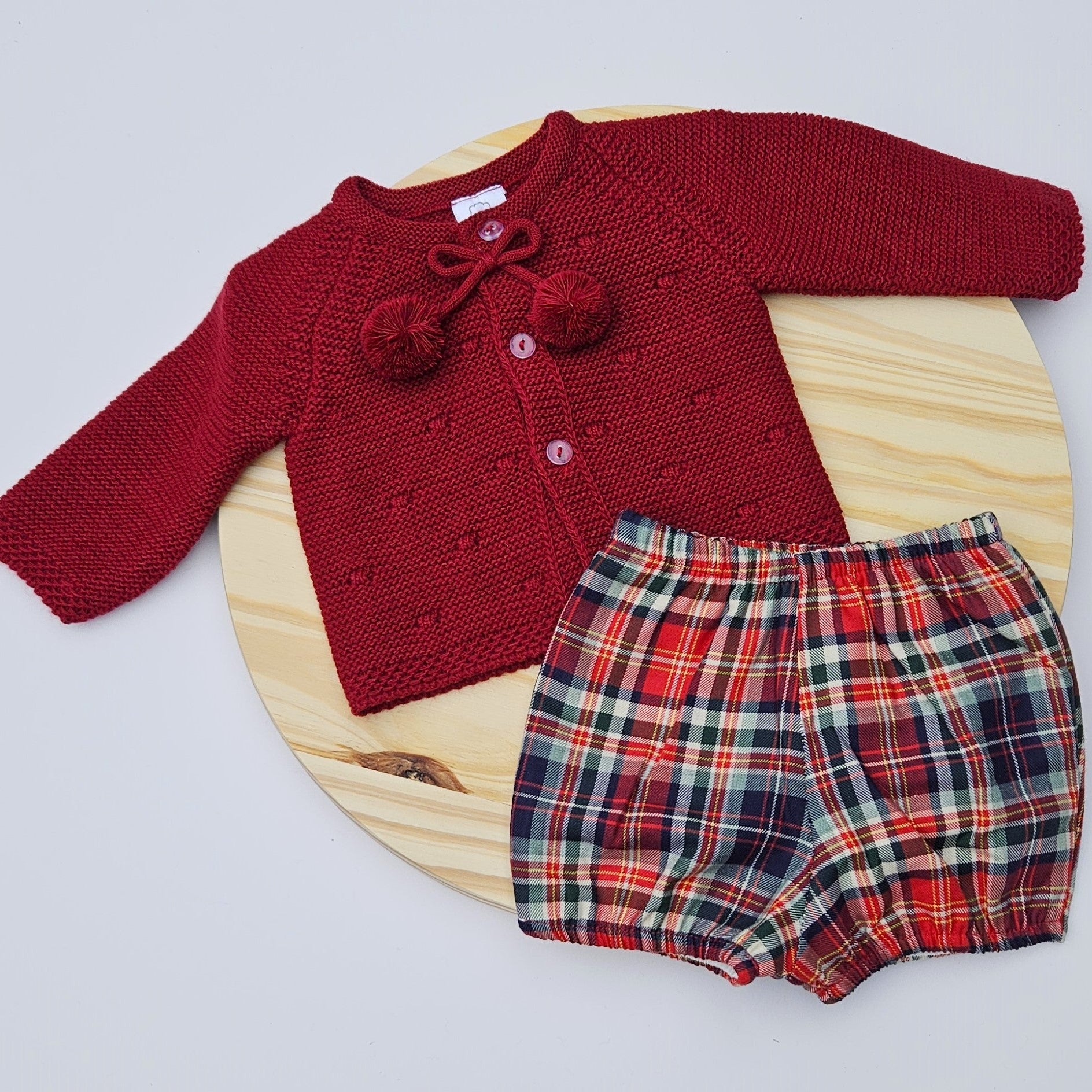 Celebrate the season in style with this charming boys Christmas outfit featuring a cozy knitted sweater paired with a coordinating diaper cover. Crafted from soft, breathable cotton, this two-piece set keeps your little one comfortable and festive all day long. The classic color options make it perfect for holiday photos, family gatherings, or everyday wear during the Christmas season. Easy to dress and undress Christmas boy outfit compost for knitted sweeter cottons diaper cover
