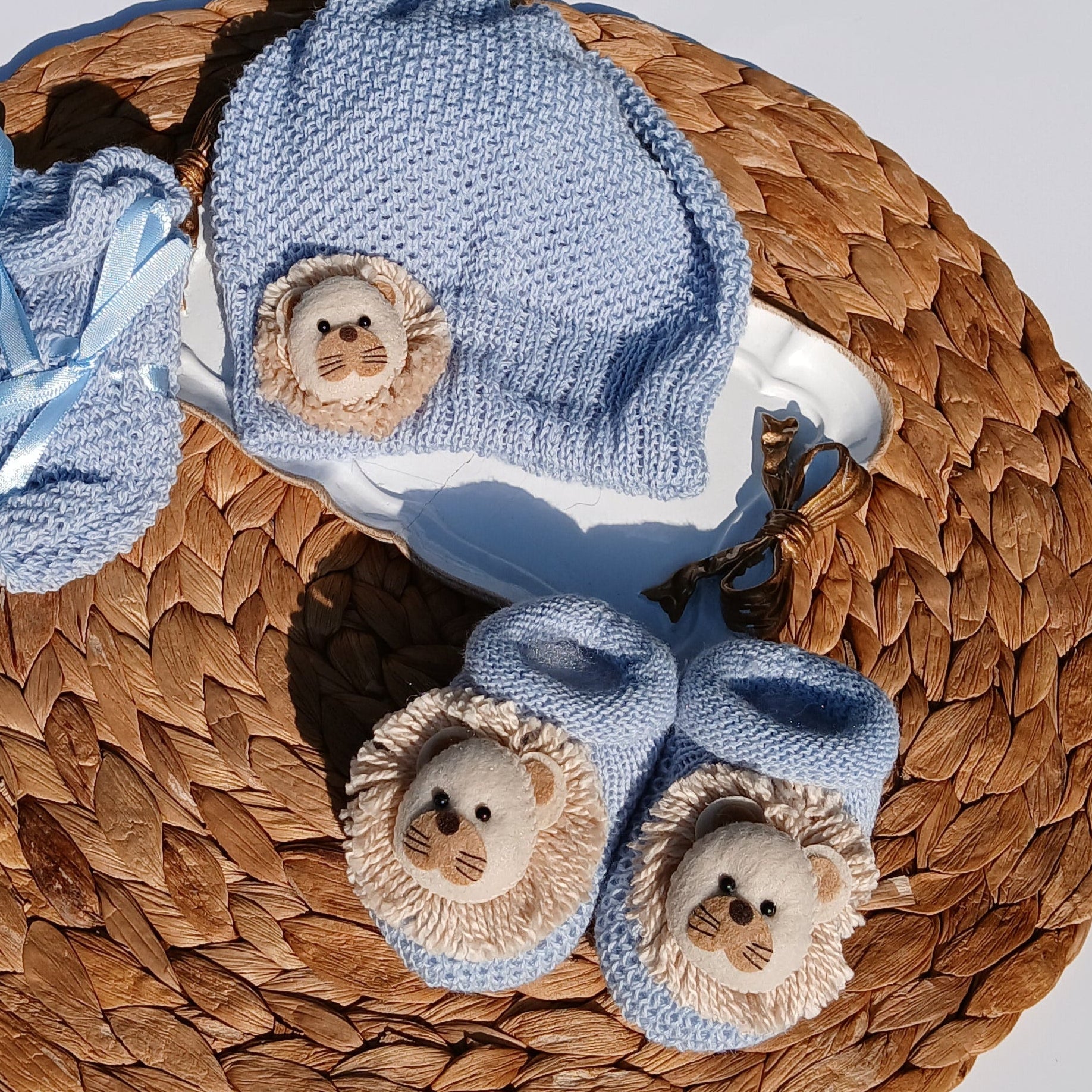 Lion theme in blue Baby hat, booties, and socks on a Mittens, knit set