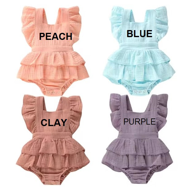 Four baby rompers in peach, blue, clay, and purple with color labels.