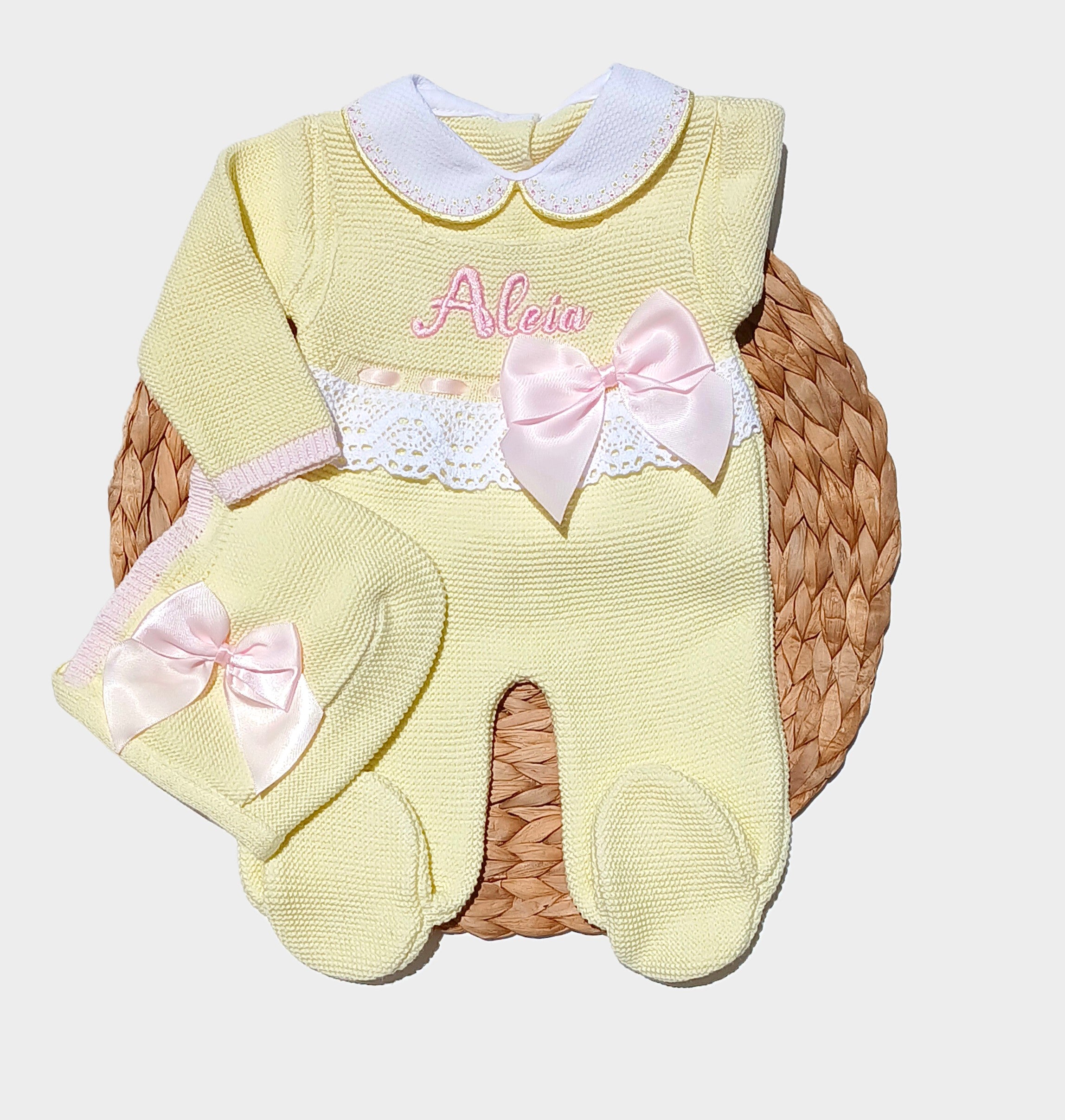 Yellow baby outfit with pink bows and white lace. Baby girl outfit with yellow sweater, overall pants, strike a pink satin bow for going home from hospital. newborn special outfit come home