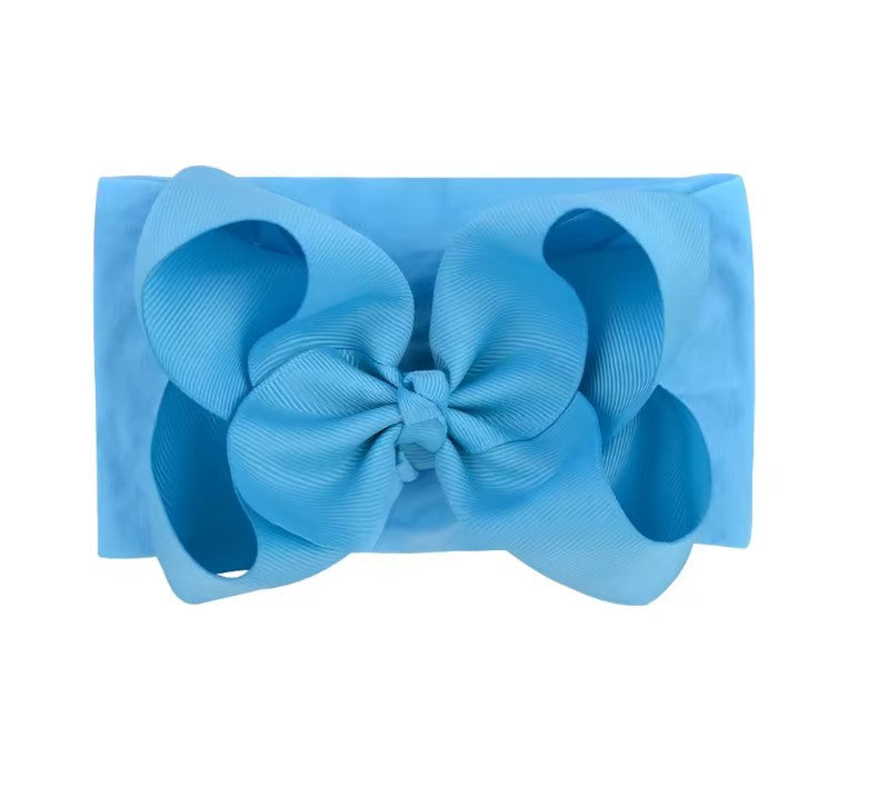 Blue clutch bag with a large bow on a white background, , large baby bow, baby headband, oversized baby bow in blue