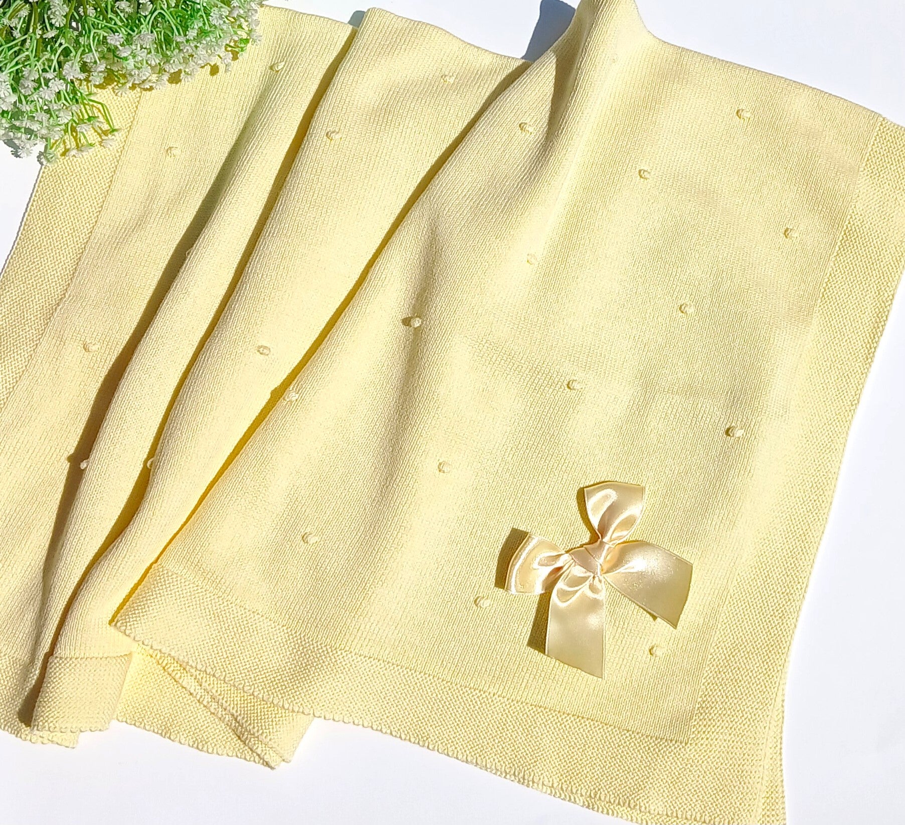 Light yellow fabric with a decorative bow on a white background european yellow baby 100 cotton with bow