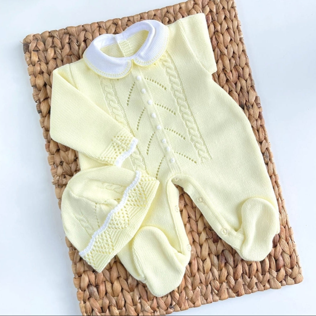 A yellow knitted baby romper with handmade embroidery, accompanied by a matching hat, displayed on a basket. Newborn Going home set , newborn neutral coming home set, baby boy yellow outfit