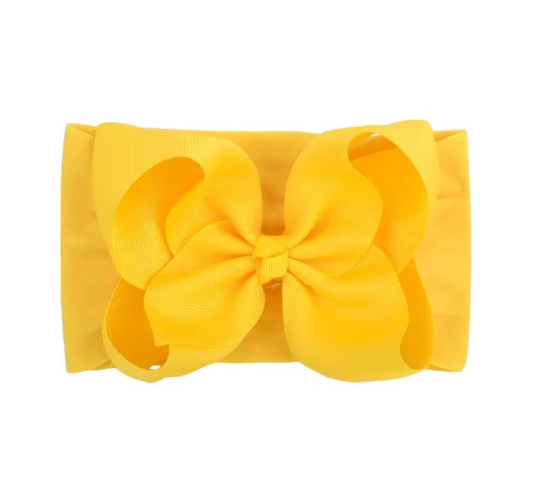 Yellow hair bow on a white background , large baby bow, baby headband, large baby bow, baby headband, oversized baby bow in yellow