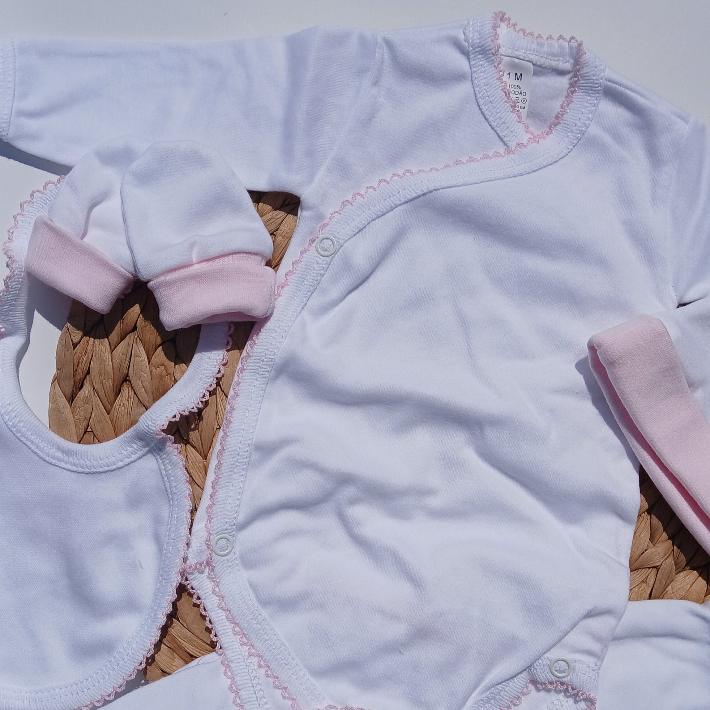 picot trim made with cotton bib, mittens hat included Baby outfit with white romper, pink headband, and white booties 