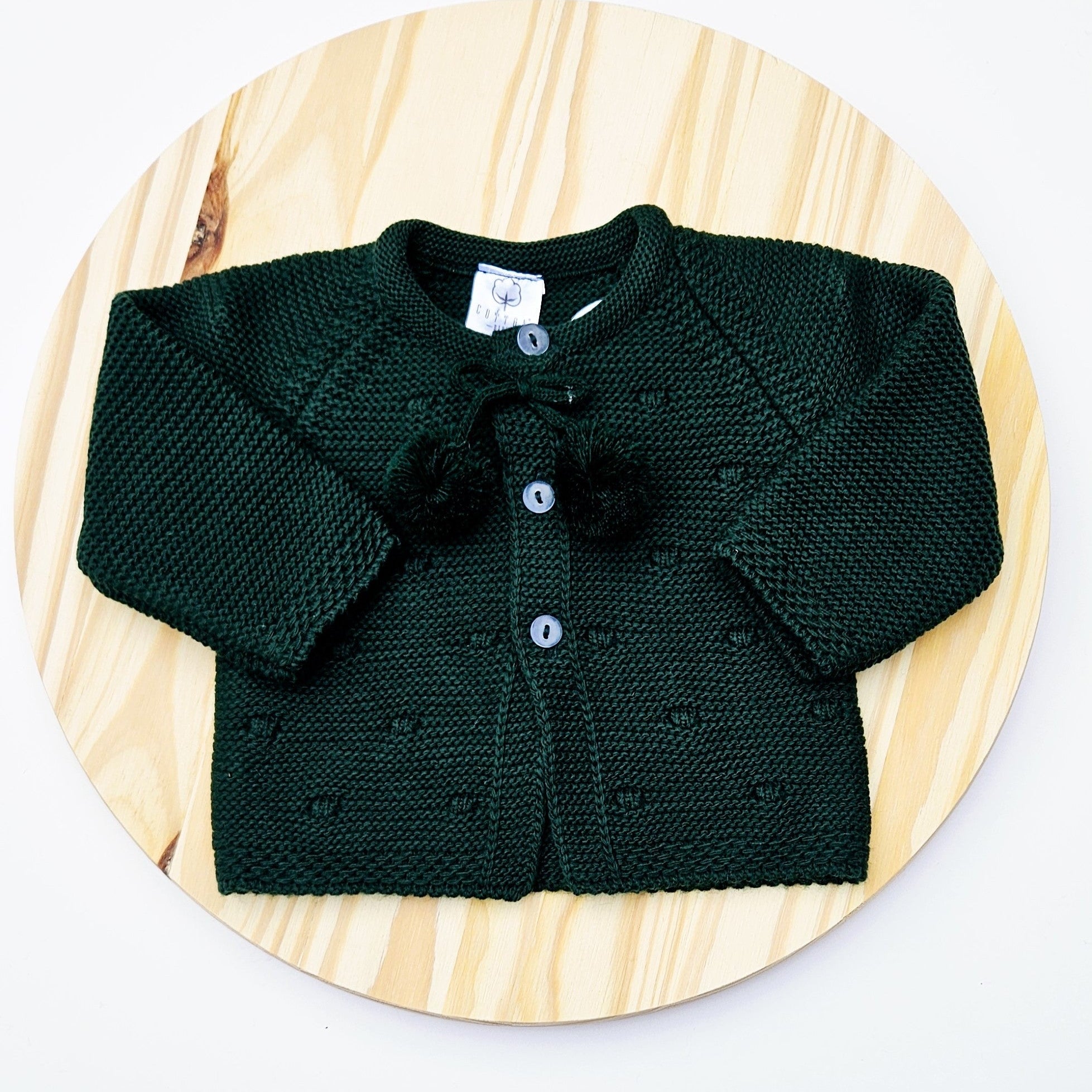 Celebrate the season in style with this charming boys Christmas outfit featuring a cozy knitted sweater paired with a coordinating plaid bloomers. This two-piece set keeps your little one comfortable and festive all day long. The classic color options make it perfect for holiday photos. Easy to dress and undress.