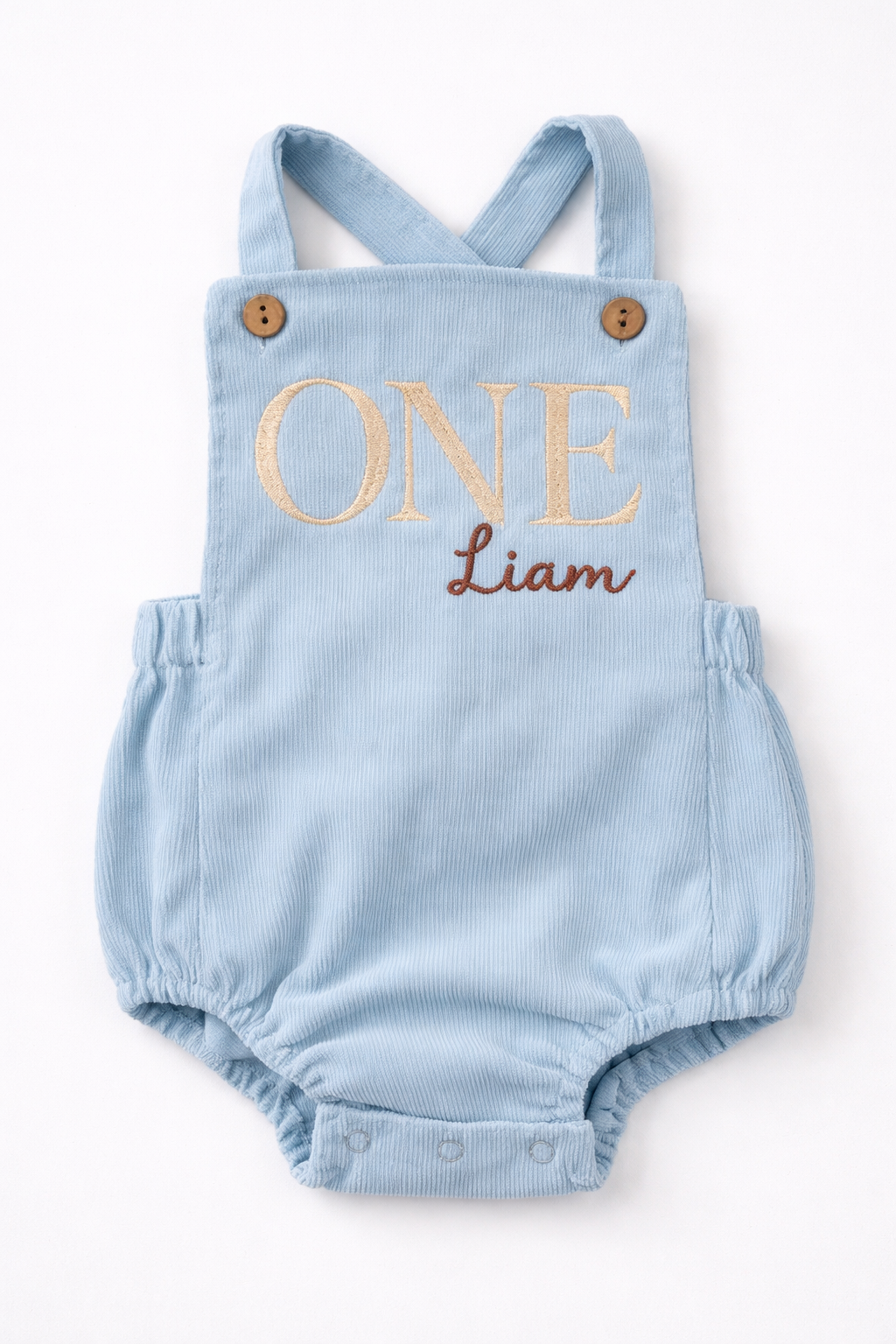 Light blue romper with 'ONE Liam' text on a white background