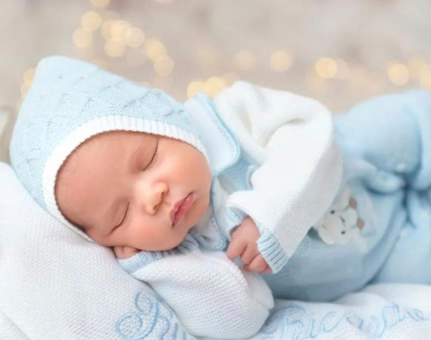 baby bunny outfit in blue with baby's name embroidered on the blanket