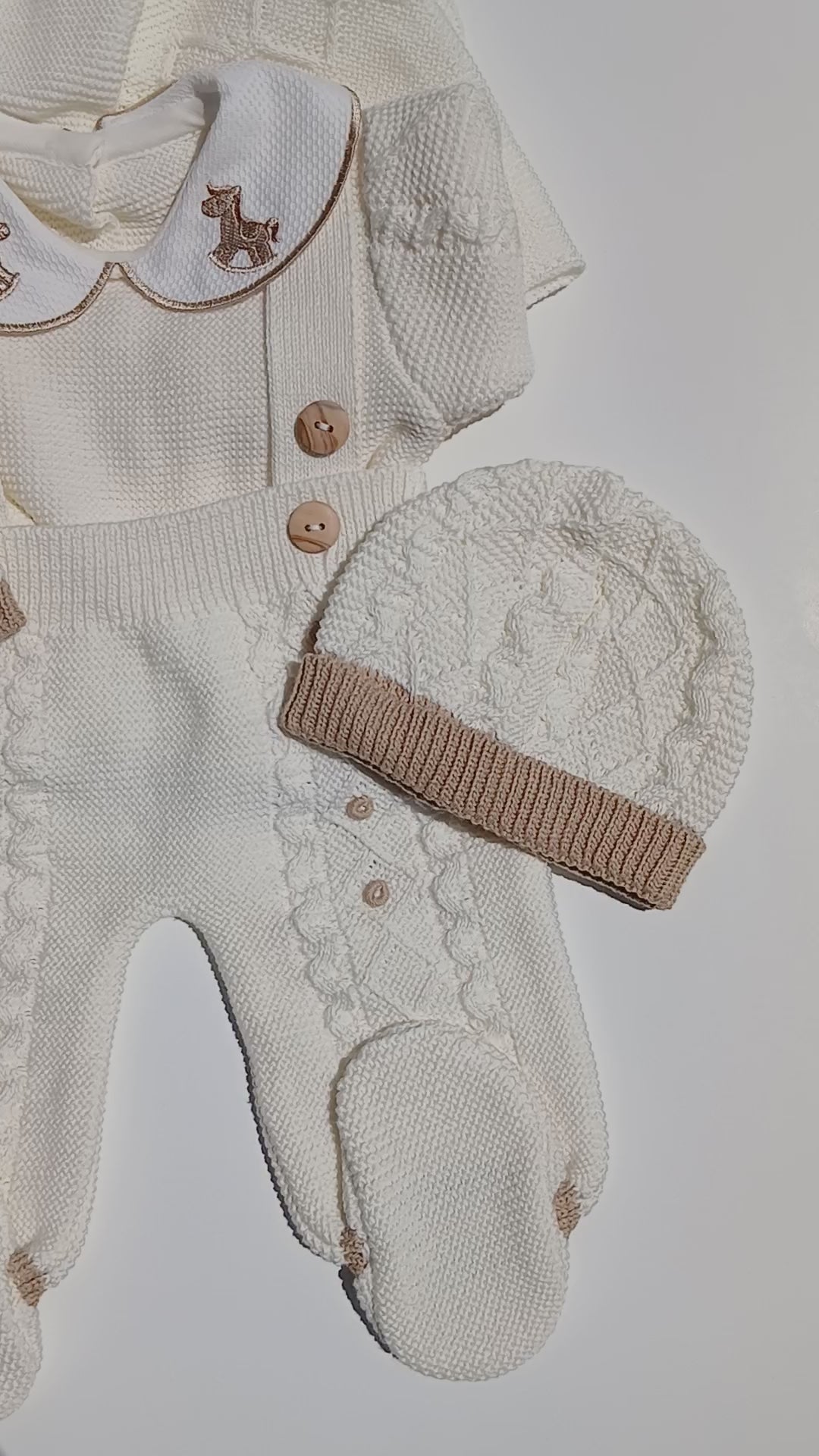Newborn  knit outfit for baby coming home from hospital, rocking horse embroidery on the collar of the outfit, and baby's name embroidery 