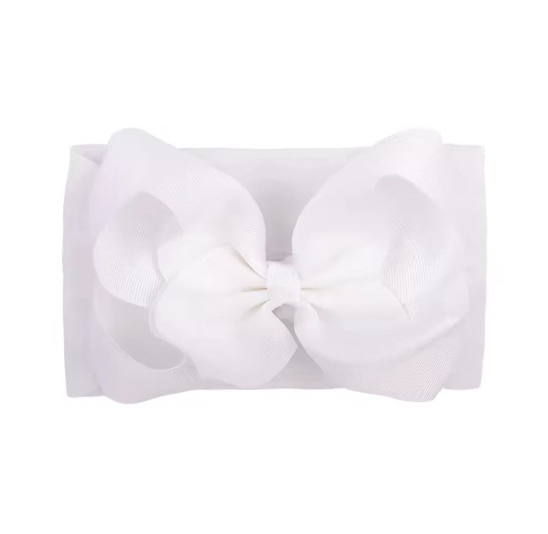 White headband with a large bow on a white background , large baby bow, baby headband